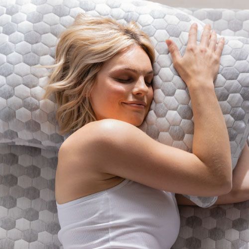 Woman sleeping to hold kapok pillow