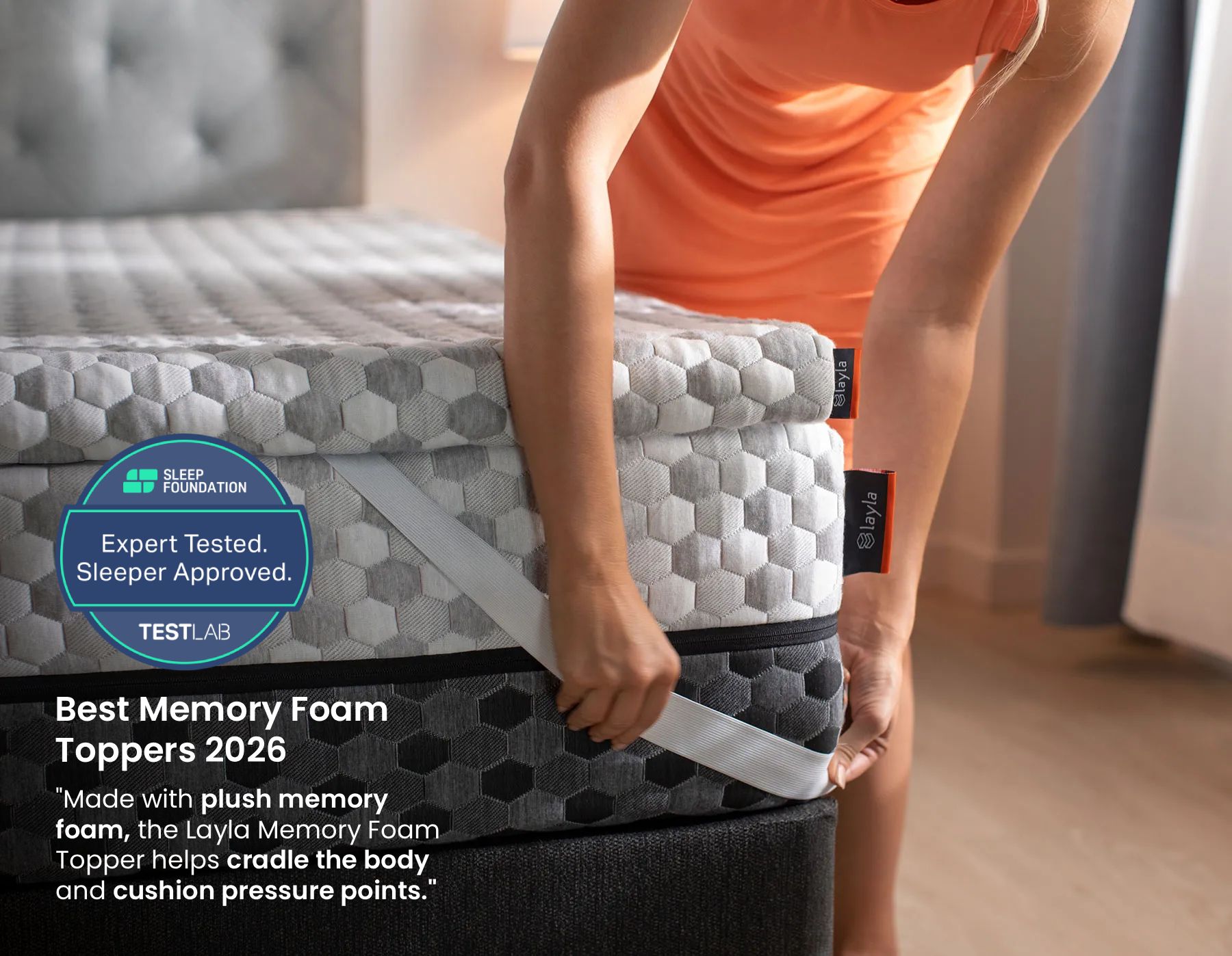 woman applying topper