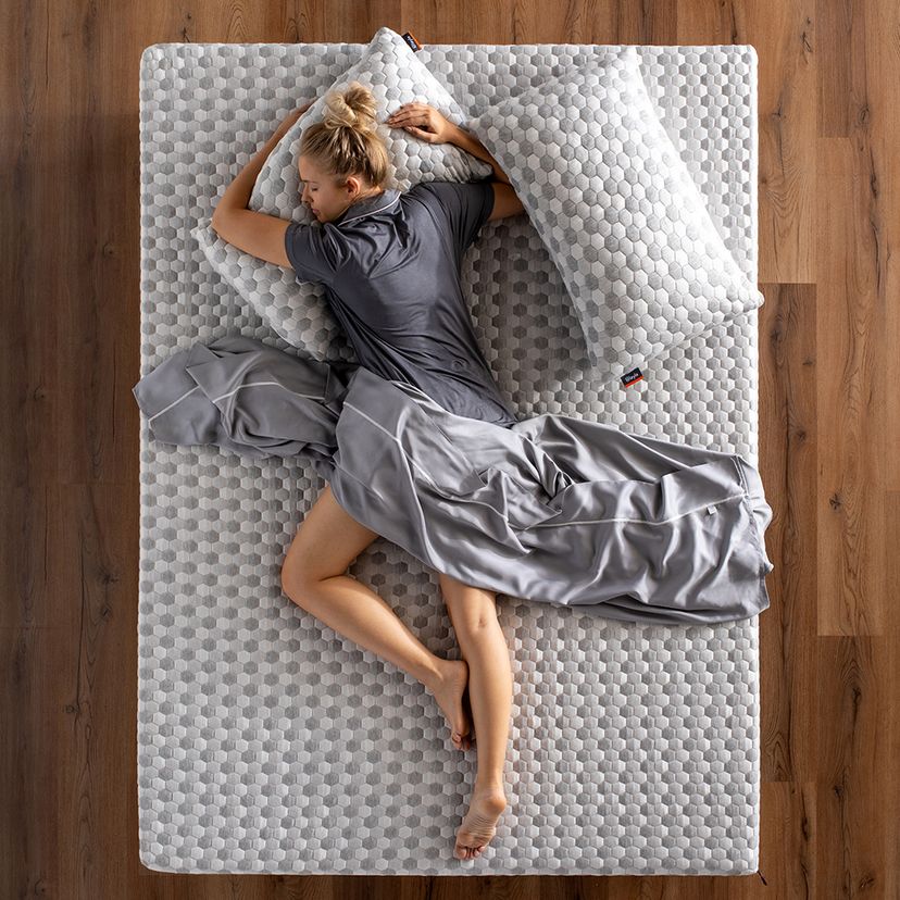 Man lying is on mattress topper