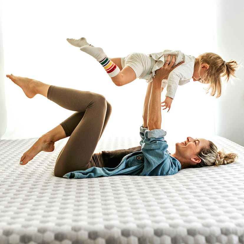 Baby Girl and Mother playing on Memory Foam Mattress