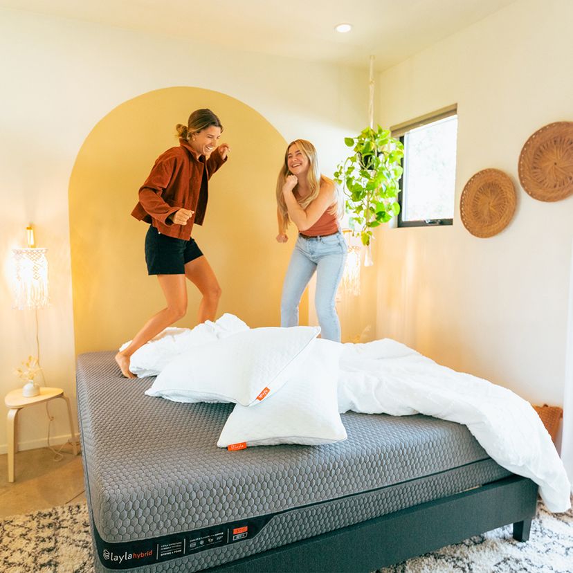 friends playing on bed