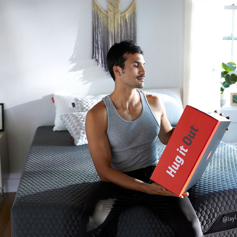 man unboxing weighted blanket